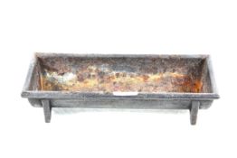 A small cast iron trough, approx. 12½