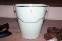 An enamel pail with swing handle