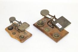 Two sets of letter postage scales with some brass weights