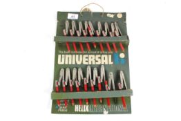 A trade card of eighteen universal compasses