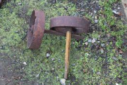 A pair of cast iron shepherd's hut wheel with axles