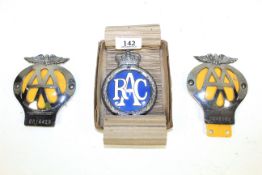 Two AA car badges and an early steel chromed RAC badge in new condition and in original box
