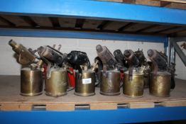 Twelve various medium sized blow lamps, some named to Primus, Ericsson, Monitor, Max Sievert etc.