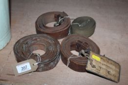 Three leather belts and a canvas belt