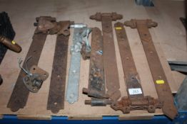 Five pairs of large door hinges and two odd hinges