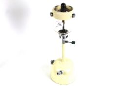 A Vapalux table lamp with cream base