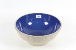 An antique glazed stoneware kitchen mixing bowl