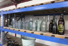 A large quantity of brown and clear glass bottles to include Lockwood & Co. Brewery of Woodbridge,