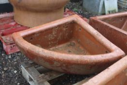 A quarter glazed stoneware horse feed bowl