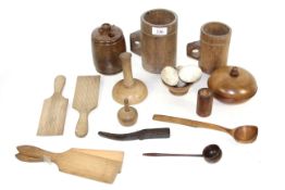 A quantity of antique domestic treen including pint and half pint measures, money box, Toddy