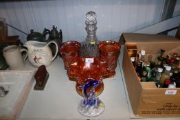 A glass decanter, a pair of Carnival glass vases,