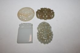 A collection of jade and stone plaques