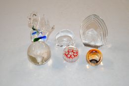 A collection of glass and other paperweights