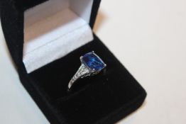 A 925 silver ring set with sapphire coloured stone