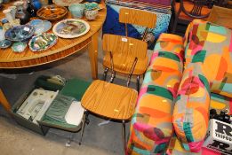 A pair of metal framed chairs