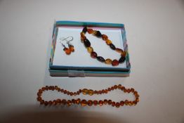 An amber necklace and amber bracelet, and silver a