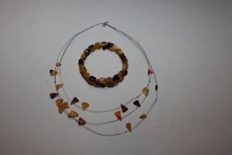 A floating Sterling silver and amber necklace and