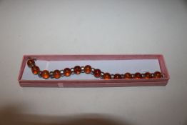 A modernist Sterling silver and amber bracelet, 17