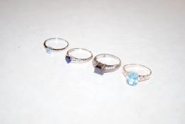 Four 925 silver dress rings set with coloured ston