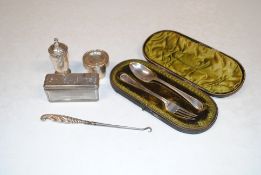 A cased silver fork and spoon, 66gms; a white meta