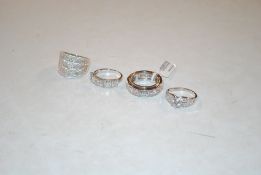 Four 925 silver dress rings set with white stones