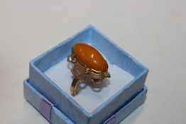 A vintage gilt and egg yolk / butterscotch amber r