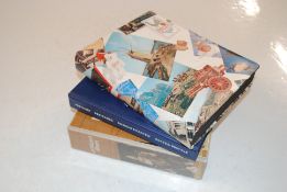 Three albums of postcards