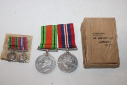 Two WWII medals with miniatures