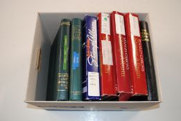 A box containing seven albums of Jersey mint stamp