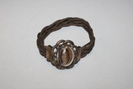 A yellow metal and hairwork memorial bracelet