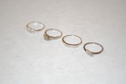 Four 925 silver dress rings set with white stones