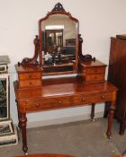 A good quality Victorian mahogany dressing table, fitted with a swing mirror above four trinket