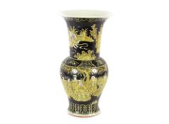 A 19th Century Chinese porcelain Famille Noire and yellow ground Yen-yen vase, painted with flowers,