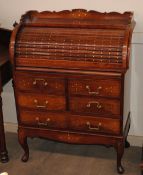 A good quality hardwood and brass inlaid roll top bureau, fitted four short and one long drawer