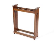 An early 20th Century oak Arts & Crafts design stick stand, shaped pierced ends with heart motifs,