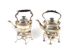 Two plated 5 o'clock tea kettles, one on sprit heater stand the other with spirit burner missing,