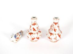 A pair of Chinese porcelain double gourd vases, painted with bats, 11cm high; and an unusual