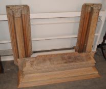 A 19th Century carved pine fireplace, flanked by Corinthian cluster columns and leaf capitals,