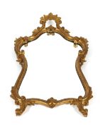 A gilt framed bevel edged wall mirror, in the Rococo manner, decorated foliate scrolls, 108cm x 60cm