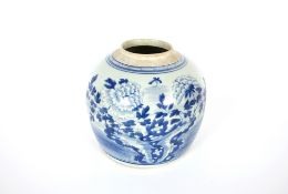 A large 19th Century Chinese porcelain blue and white ginger jar, painted with peonies and rock