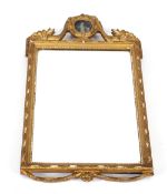 A 19th Century gilt framed pier mirror, with applied foliate scroll decoration, the pediment inset