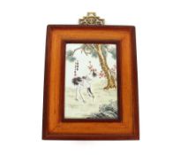 A Chinese porcelain rectangular plaque, painted with a pair of red crowned Asian cranes in a