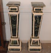A pair of green and cream marble columns, tapering square section, 113cm high