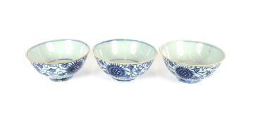 Three large blue and white Chinese porcelain bowls, having floral decoration, seal mark to bases,