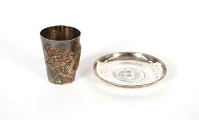 A Chinese silver tumbler, with raised dragon design, seal mark to base; and a Chinese silver dish