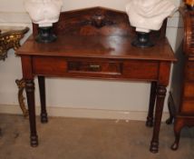 A Victorian mahogany hall table, fitted with a singe drawer having shaped backpiece with foliate