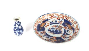 An 18th Century Chinese porcelain under glazed blue and iron red plate, 21.5cm dia.; and a 19th