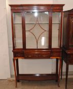 An Edwardian painted satinwood china display cabinet, the interior glass shelves enclosed by a