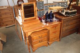 A pine dressing table fitted three drawers, a simi