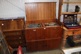 A record cabinet containing Thorens turntable and